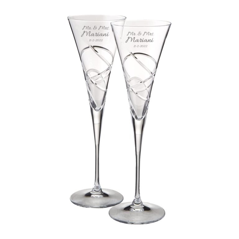 Two engraved champagne flutes with "Mr. & Mrs. Mariani" and date