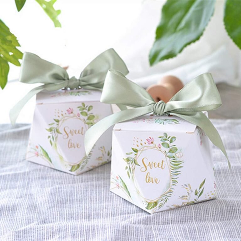 Two gift boxes with "Sweet Love" and green bows on a table