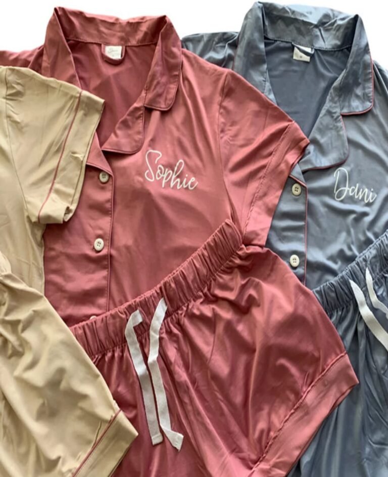 Silk pajamas in pink, gray, and beige with personalized names embroidered