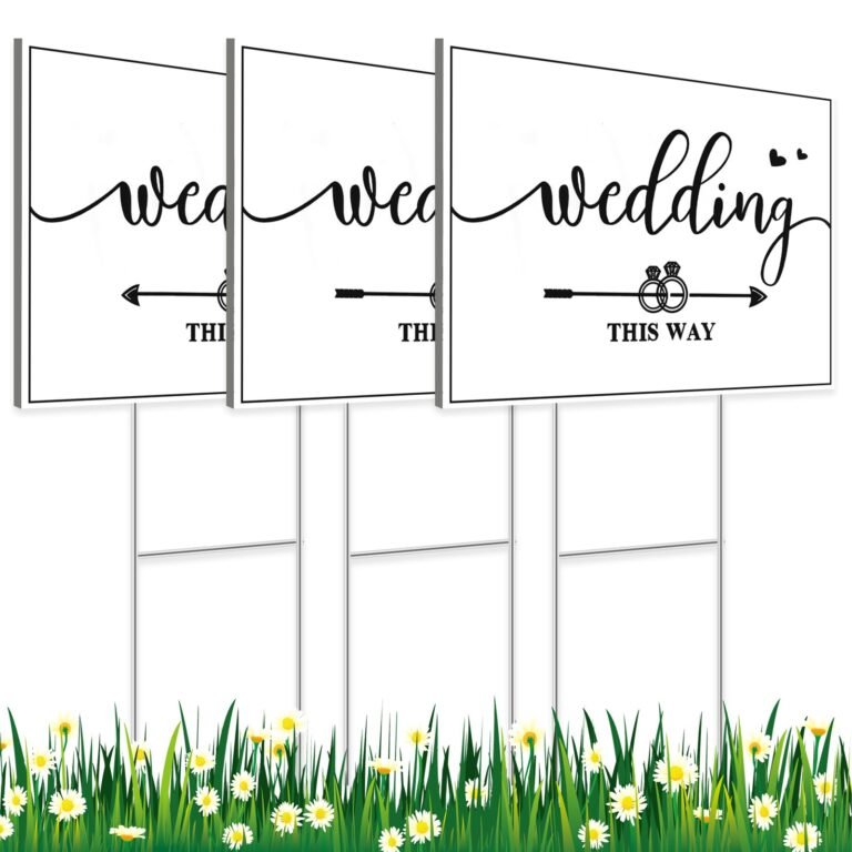 Three "Wedding This Way" signs with arrows, rings, and grass