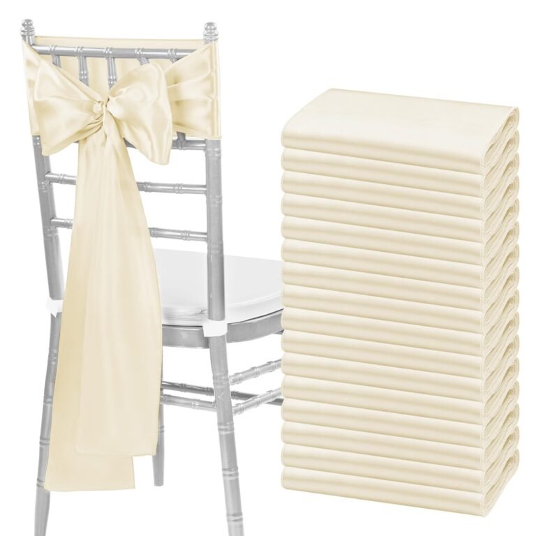 Silver chair with ivory bow and stack of folded chair sashes
