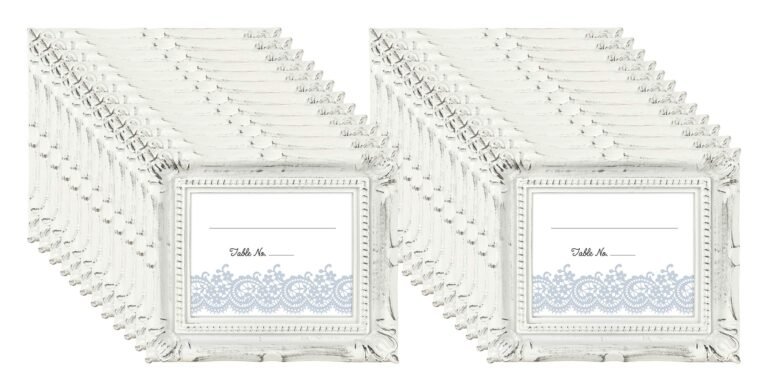 White ornate picture frames with space for names and table numbers